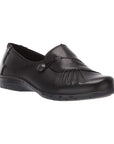 Black slip on shoe with front gathering and pewter button.