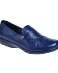 Navy slip on shoe with front gathering and pewter button.