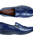 Top and side view of navy slip on shoe with front gathering and pewter button.