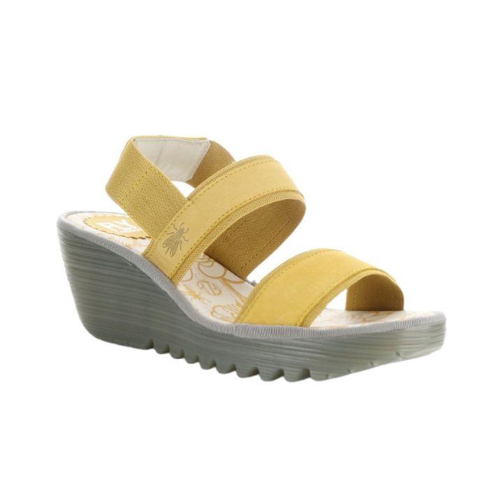 Yellow sandal on a platform wedge outsole.