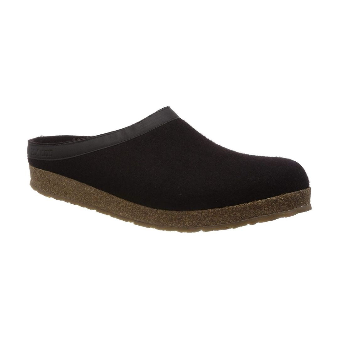 Black wool slide slipper with leather band, cork midsole and brown rubber outsole.