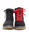 Front view of black leather boot with brown outsole, left with black laces and right with red laces.