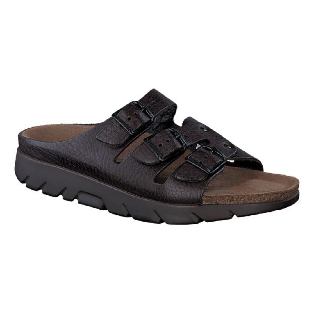 Dark brown leather sandal with 3 buckle straps across foot with a black outsole on the slip on Zach footed sandal by Mephisto