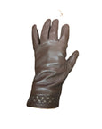 Top view of brown leather gloves with heart shaped stitching and cutouts along the cuff.