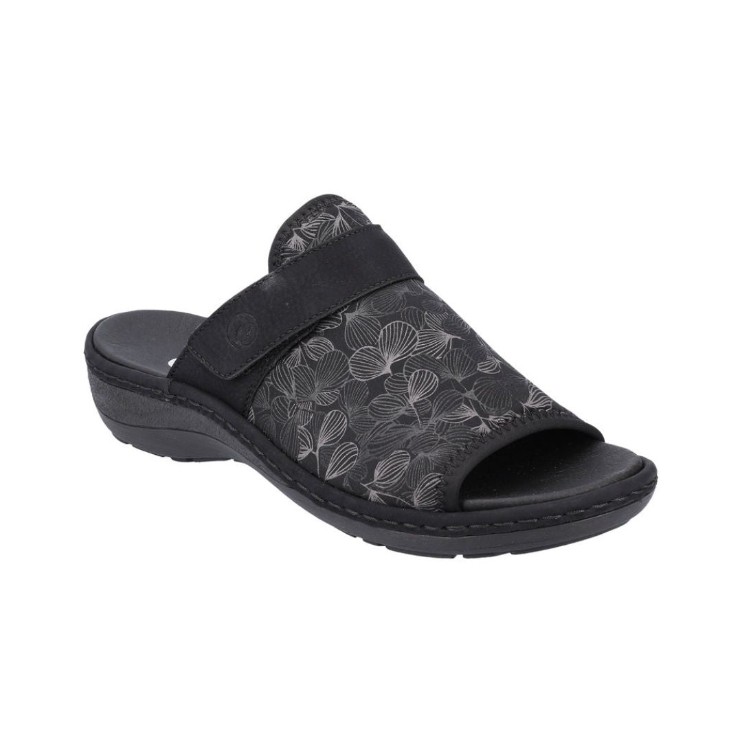 Black slide sandal with silver floral print. 