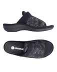 Black slide sandal with silver floral print. Silver Remonte logo on footbed.