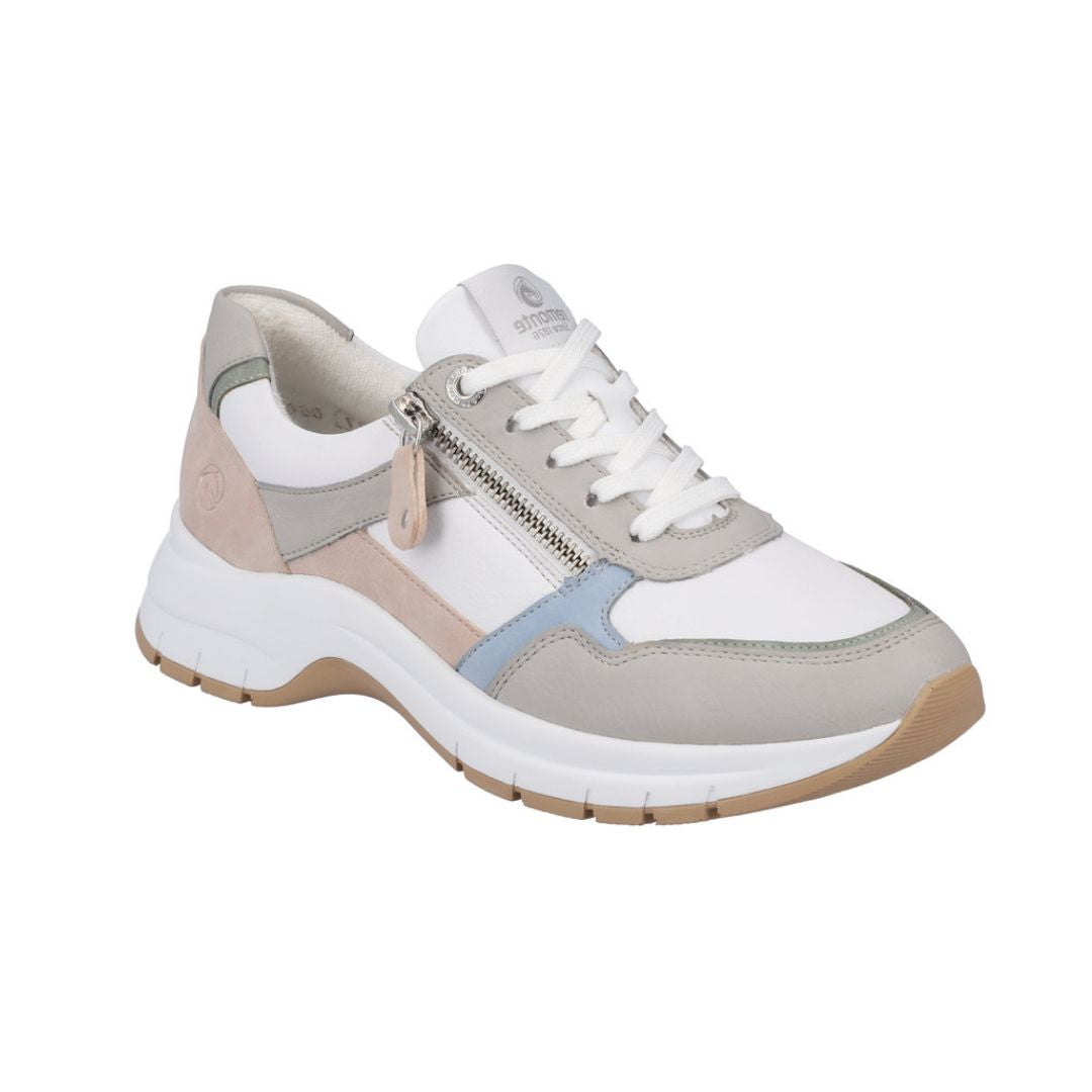 White, pale pink, blue and green sneaker with white laces and side zipper closure.