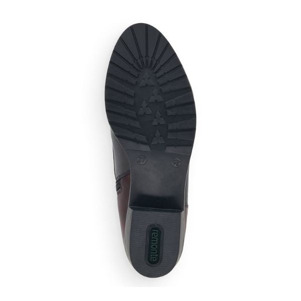 Black rubber outsole with green Remonte logo on heel.