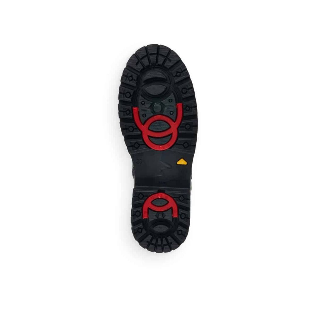 Black rubber outsole with red collapsible ice cleats