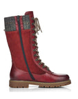 Mid-height red leather winter boot with lace closure, yarn cuff, full length zipper and brown outsole with grip.