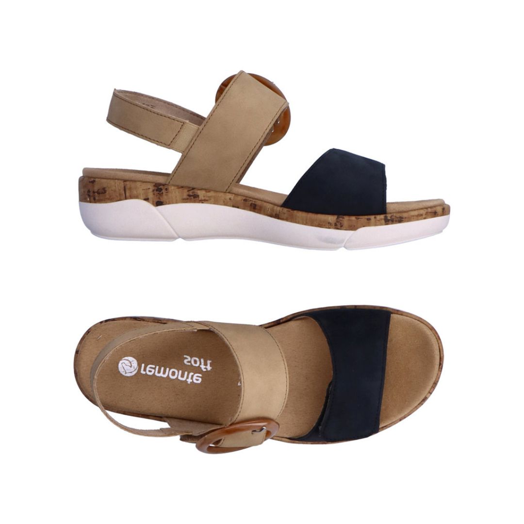Pair of Backstrap Sandals in tan and navy with oversized buckle, tan Remonte logo'd footbed, adjustable straps, faux cork midsole and white outsole.