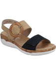 Backstrap Sandal in tan and navy with oversized buckle, adjustable straps, faux cork midsole and white outsole.