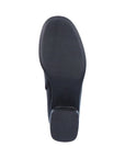 Black rubber outsole of women's boot with stacked heel.