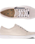 Top and side view of Revere's Ripon sneaker in beige with white laces and a gold zipper.