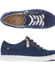 Top and side view of Revere's Ripon sneaker in denim with white laces and a gold zipper.