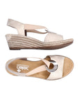 Top and side view of light gold wedge sandal with silver circle detail
