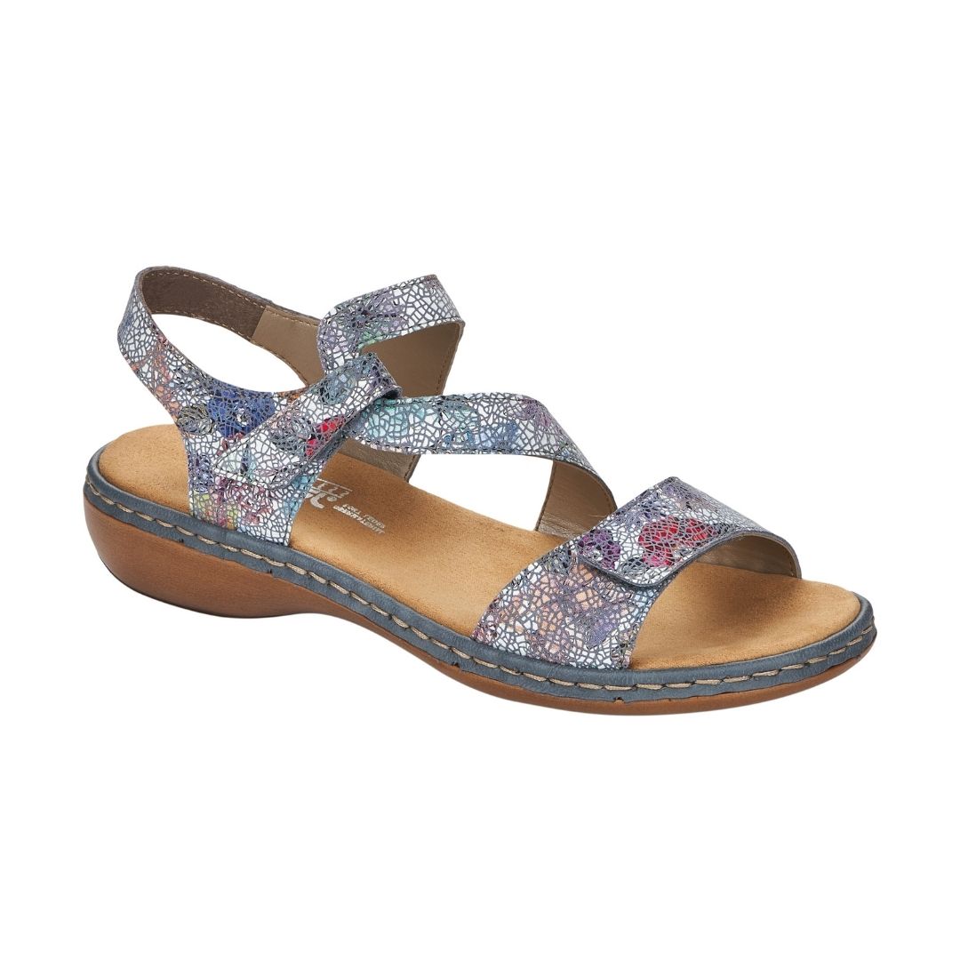 Blue multi sandal with Velcro toe strap and Velcro loop ankle strap with slight block heel and tan footbed