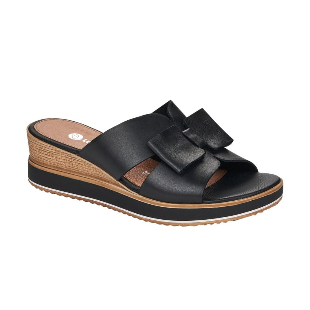 Black leather slide wedge sandal with bow.