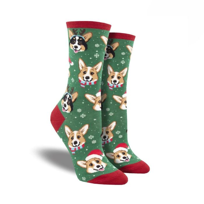 Women's Socksmith Pawlidays Socks in green with red trim, decorated with cheerful holiday Corgi dog faces. Perfect cotton crew socks for Christmas.