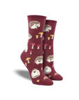 Burgandy socks with hedge hogs and mushrooms on them