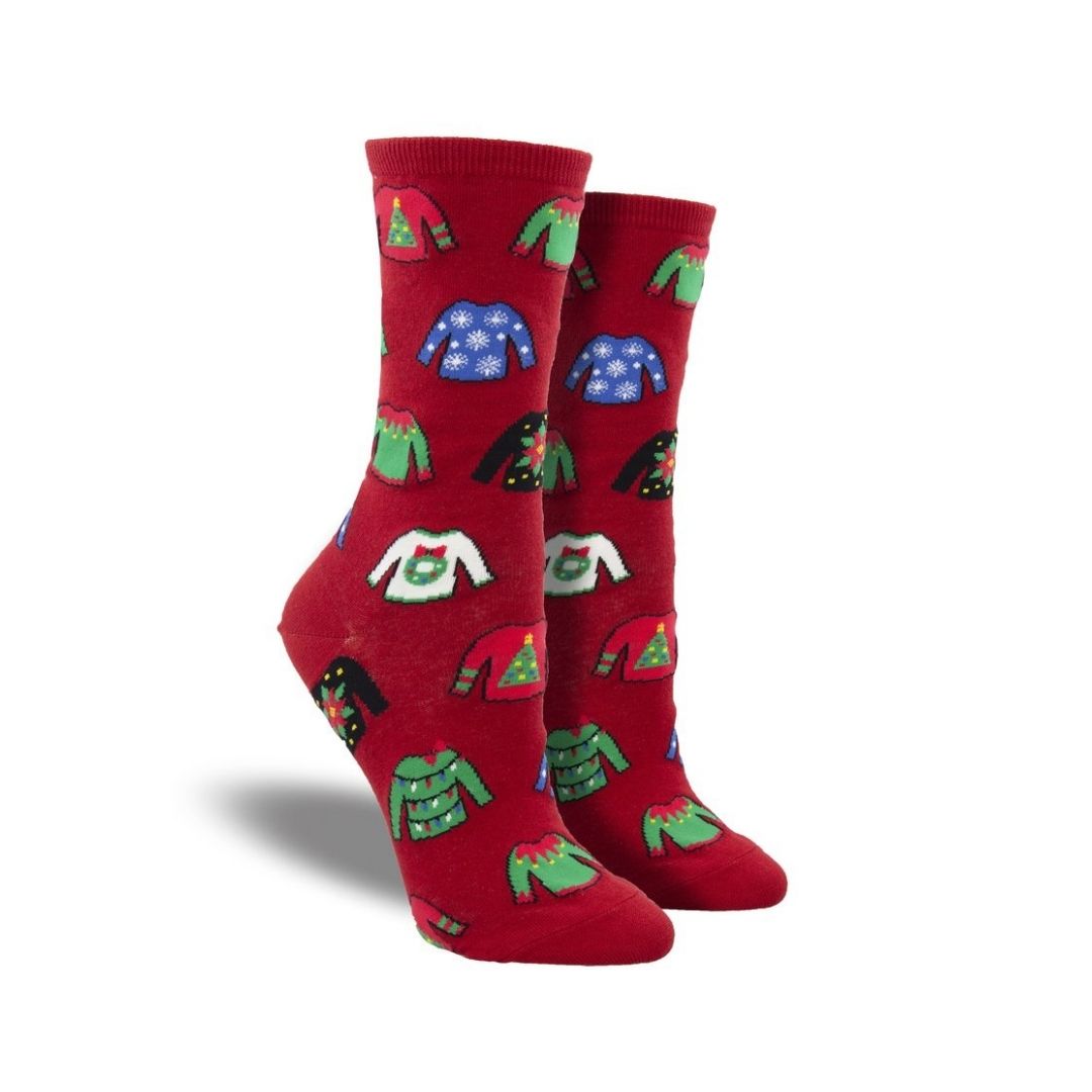 Socks in red with festive sweater patterns. 