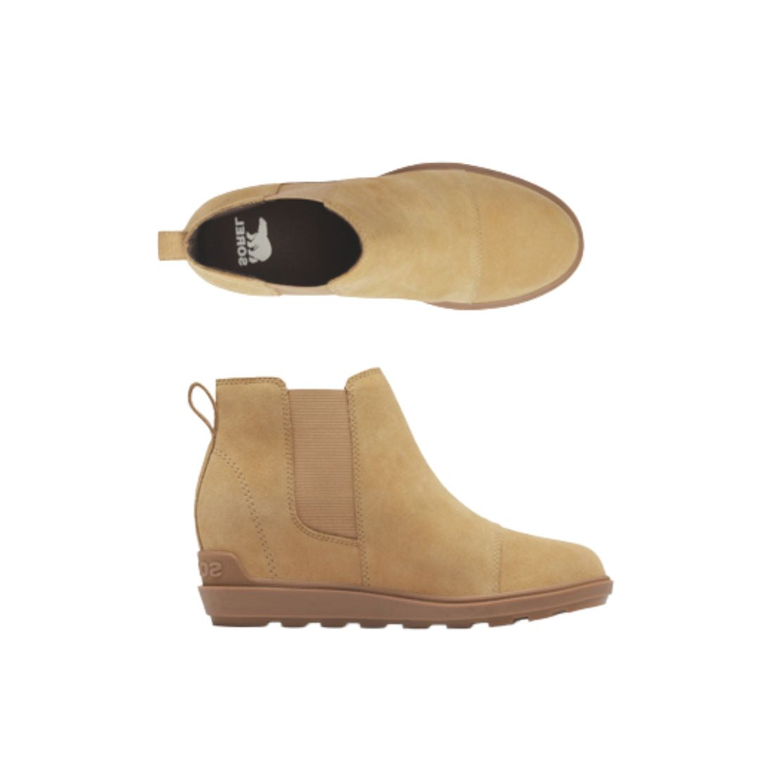 Tan leather wedge ankle Chelsea boot with heel pull tab. Black insole has white Sorel logo on heel.