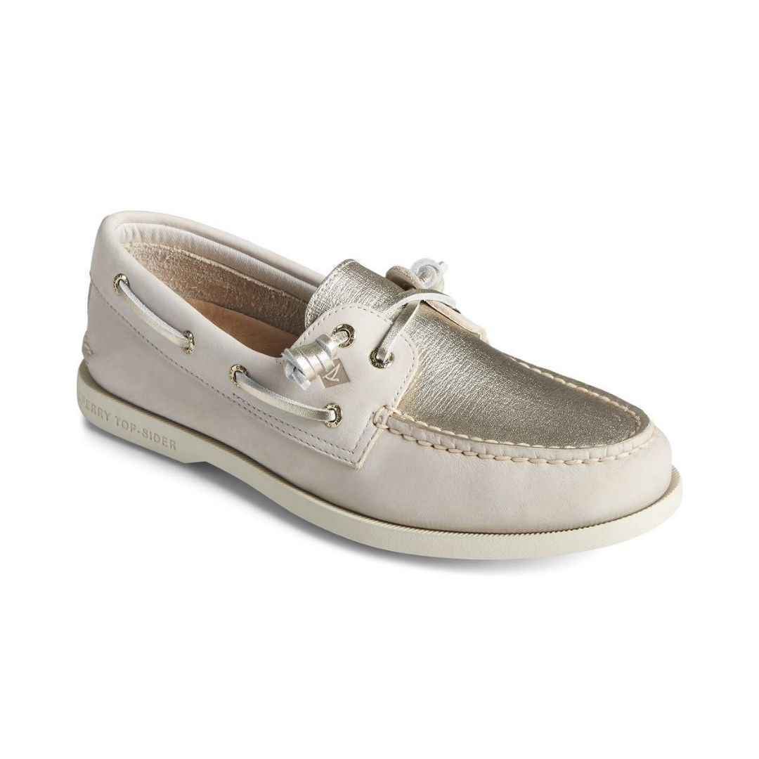 Gold and cream leather boat shoe with metallic gold leather laces cream outsole.