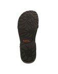 Black outsole with floral style tread. Orange Taos logo in center.