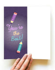 Purple card with pencils writing "You're the best!"
