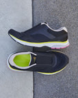 Black slip on sneaker with yellow and white midsole.