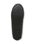 Black rubber outsole of women's ballerina flat with Vionic logo on center.