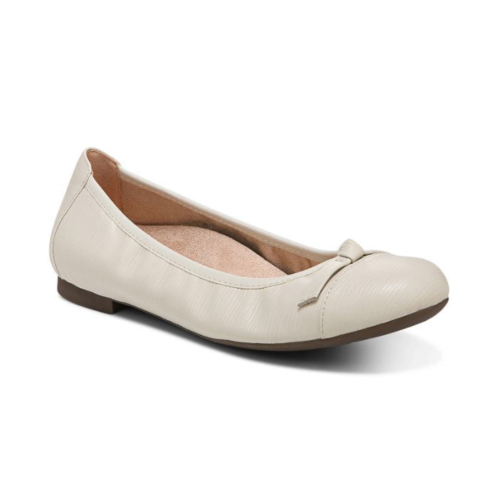 White ballerina flat with bow on toe.