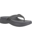 Pewter thong sandal with wedge outsole.
