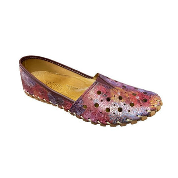 Purple multi leather flat with round cutouts. These have a whip stitch construction and have a leather covered insole.