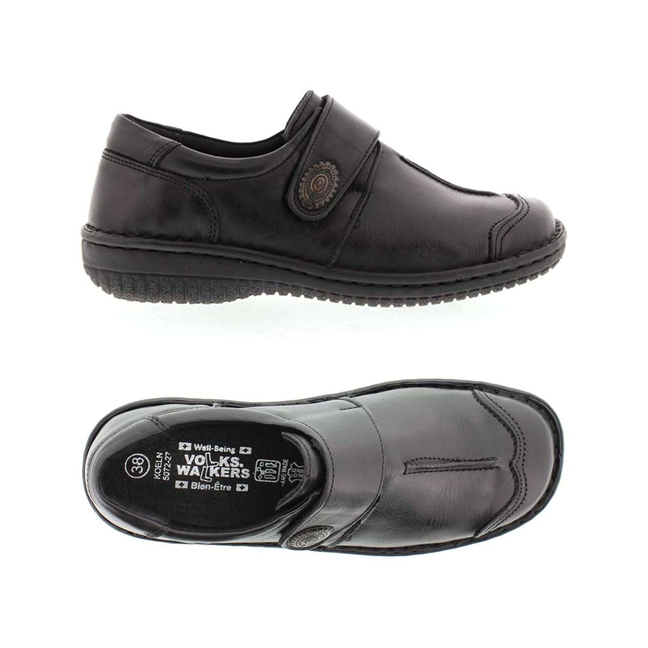 Black slip on shoe with Velcro cross strap with metal detail and detailing stitching from top and side view
