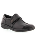 Black slip on shoe with Velcro cross strap with metal detail and detailing stitching