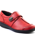Red slip on shoe with Velcro cross strap with metal detail and detailing stitching