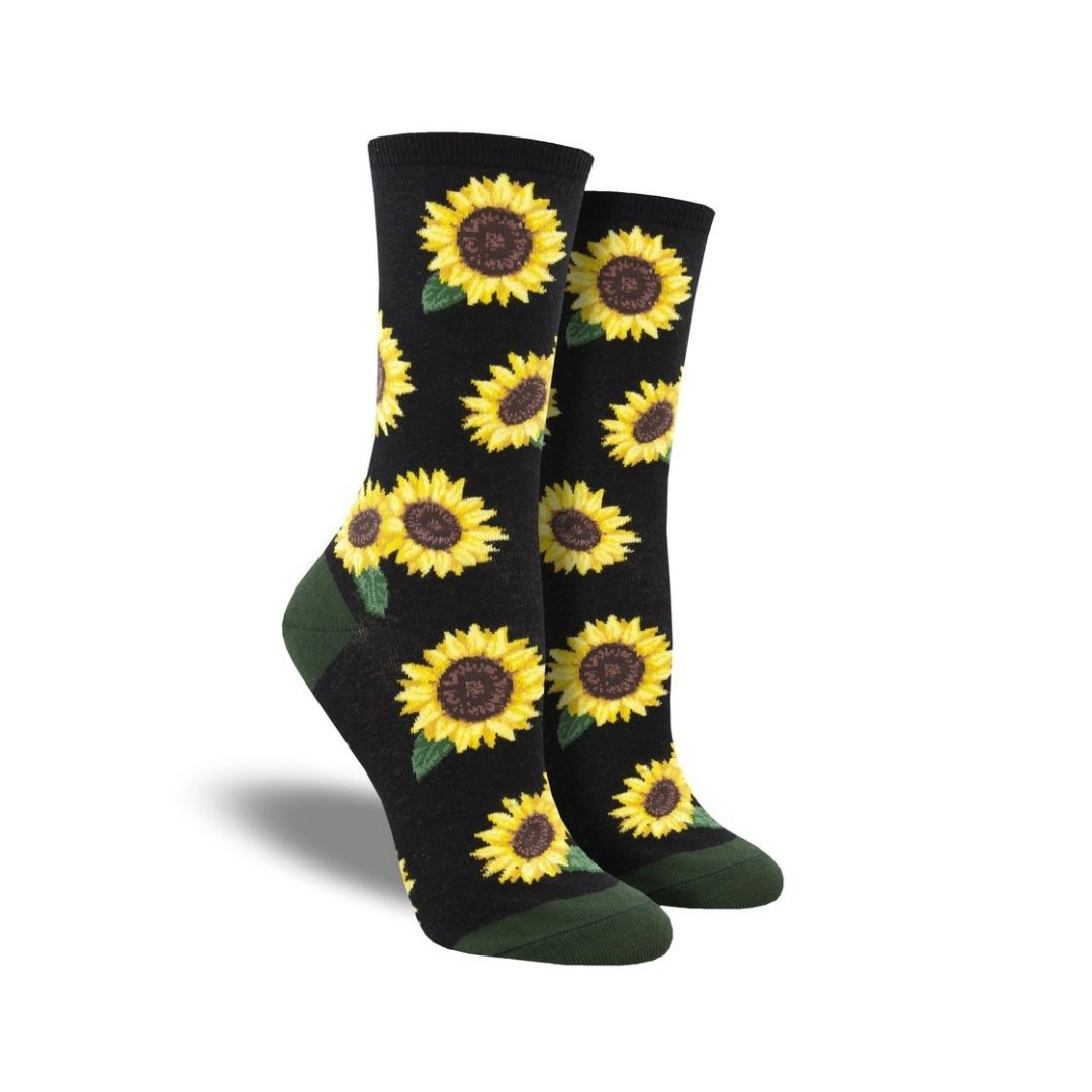 Women's Socksmith More Blooming cotton crew socks in black featuring bold yellow sunflower design, ideal for stylish floral-themed outfits.