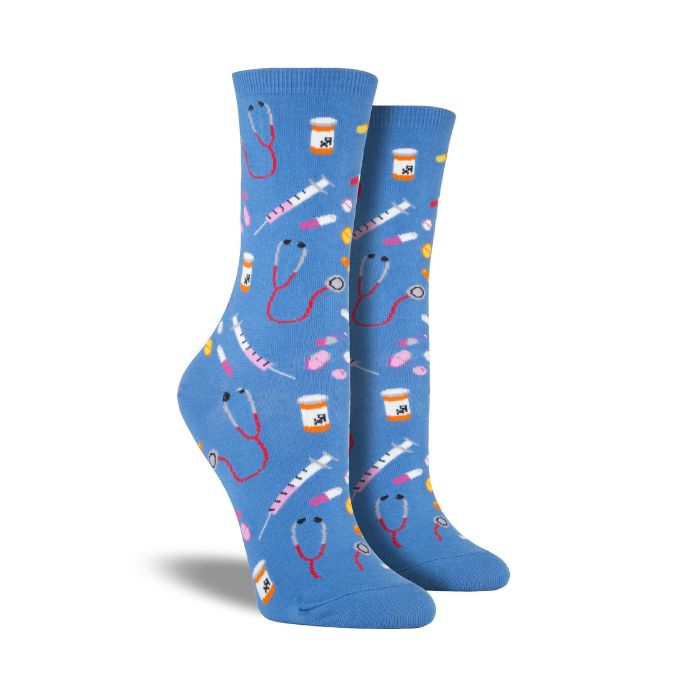 Socksmith Women's Meds Socks in blue with colorful medical-themed prints like syringes, pills, and stethoscopes. Cotton crew socks for healthcare workers.