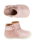 Top and side view of sparkly pink leather ankle bootie with side bow, inside zipper and white outsole
