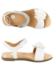Top and side view of white backstrap sandal with oversized flower detail on front strap. Stride Rite logo on heel.