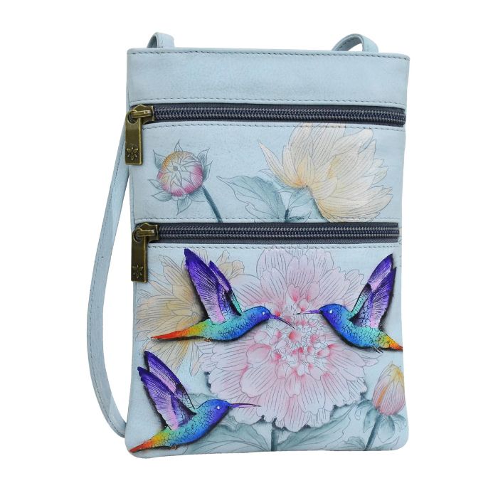 Blue leather crossbody handbag with two horizontal zippers. Has a floral hand painted design with three hummingbirds.
