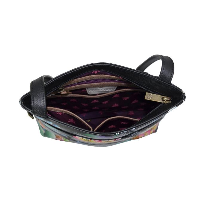 Inside view of Anuschka handbag with purple lining, zippered pocket and two slip pockets.