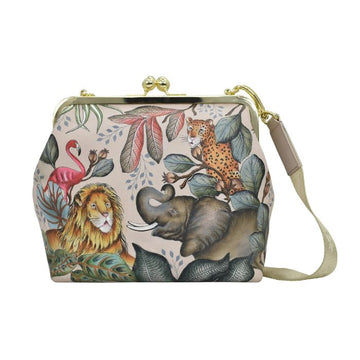 Beige satchel with hand painted safari animal design. This bag features a gold clasp closure and crossbody strap.