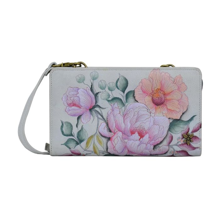 Grey leather wallet with bronze hardware and a removable crossbody strap. Hand painted floral design. 