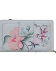 Rear exterior of grey leather wallet featuring a slip pocket with a velcro strap closure. Hand painted floral design.
