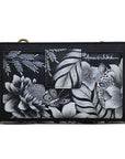 Rear exterior of greyscale leather wallet featuring a slip pocket. Hand painted artwork depicts florals and a white leopard with blue eyes.