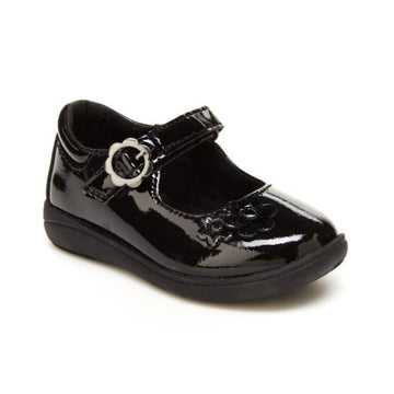 Black patent leather Mary-Jane shoe with floral details. Shoe has pewter floral buckle.