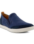 Navy leather slip on shoe with elastic goring and white outsole.