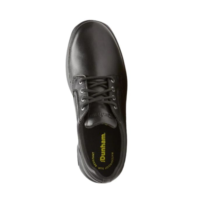 Top view of smooth black leather lace-up shoe. Dunham logo imprinted on tongue. Yellow Dunham logo on heel of insole. with round toe